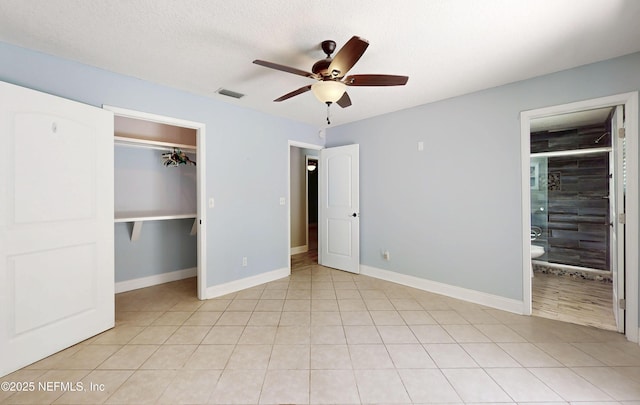 4147 Saunders Dr, Middleburg, FL 32068 - unfurnished bedroom with a walk in closet, a closet, visible vents, and baseboards