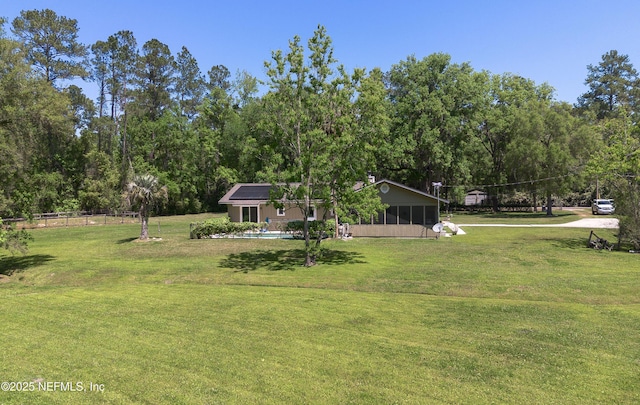 4147 Saunders Dr, Middleburg, FL 32068 - view of yard featuring a sunroom and fence