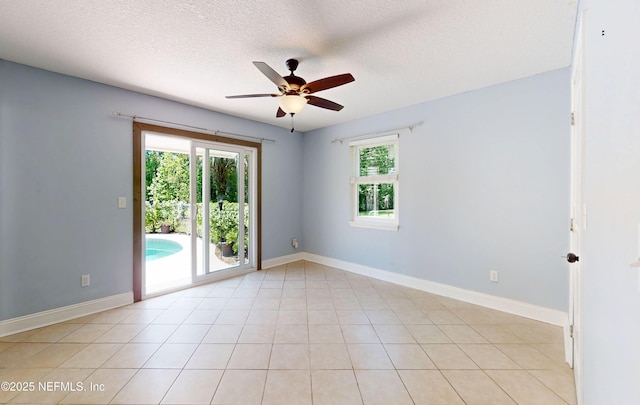 4147 Saunders Dr, Middleburg, FL 32068 - unfurnished room with baseboards, a wealth of natural light, a textured ceiling, and ceiling fan