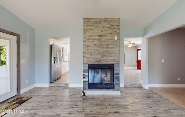 4147 Saunders Dr, Middleburg, FL 32068 - unfurnished living room with a wealth of natural light, a ceiling fan, and light wood-type flooring