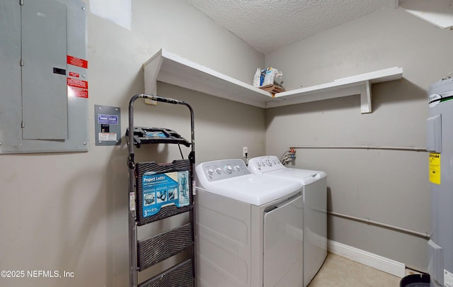 4147 Saunders Dr, Middleburg, FL 32068 - laundry room featuring electric water heater, a textured ceiling, light tile patterned floors, laundry area, and independent washer and dryer