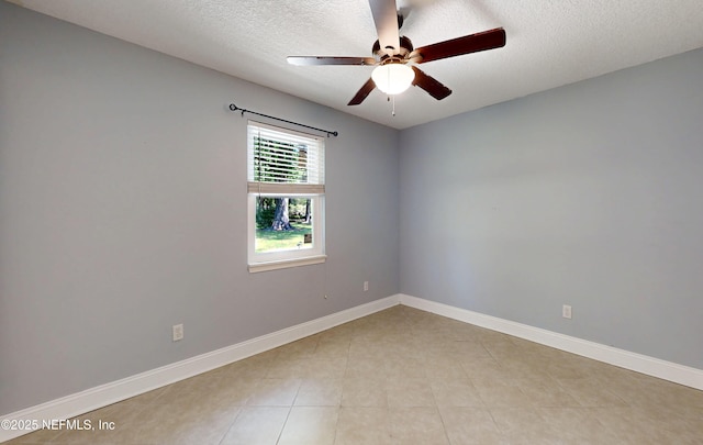 4147 Saunders Dr, Middleburg, FL 32068 - spare room with baseboards, a ceiling fan, and a textured ceiling