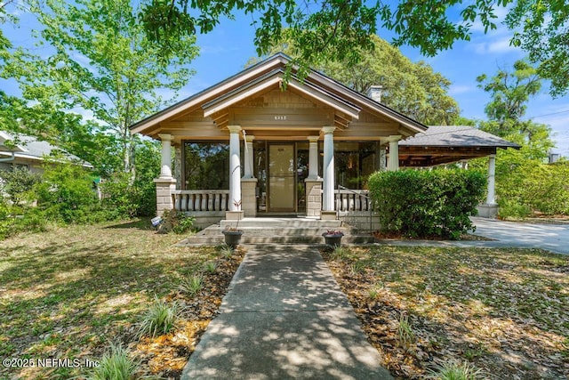 4215 Irvington Ave, Jacksonville, FL 32210 - view of front of property featuring a porch and a chimney