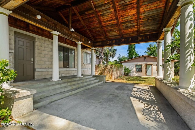 4215 Irvington Ave, Jacksonville, FL 32210 - view of patio featuring a porch and an outbuilding