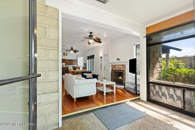 4215 Irvington Ave, Jacksonville, FL 32210 - living area featuring ornamental molding, a ceiling fan, and a fireplace