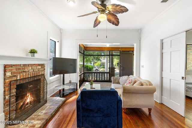 4215 Irvington Ave, Jacksonville, FL 32210 - living area with crown molding, wood-type flooring, a ceiling fan, and a wealth of natural light