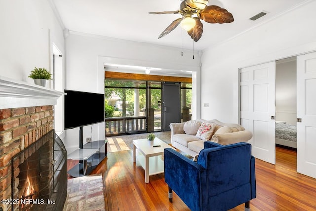 4215 Irvington Ave, Jacksonville, FL 32210 - living area featuring crown molding, visible vents, a ceiling fan, and wood finished floors