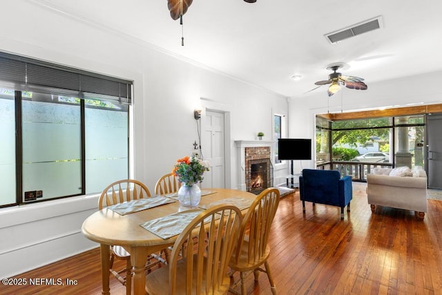 4215 Irvington Ave, Jacksonville, FL 32210 - dining area with visible vents, a wealth of natural light, a ceiling fan, and a fireplace
