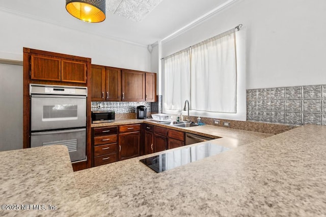 4215 Irvington Ave, Jacksonville, FL 32210 - kitchen with tasteful backsplash, multiple ovens, light countertops, and a sink