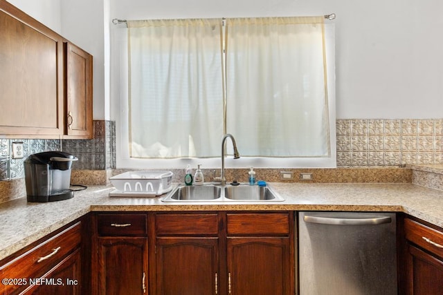 4215 Irvington Ave, Jacksonville, FL 32210 - kitchen with dishwasher, light countertops, a sink, and decorative backsplash