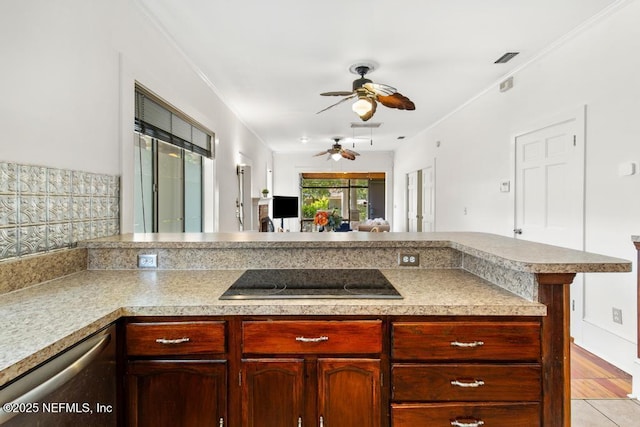 4215 Irvington Ave, Jacksonville, FL 32210 - kitchen featuring a peninsula, dark brown cabinets, black electric cooktop, ceiling fan, and stainless steel dishwasher