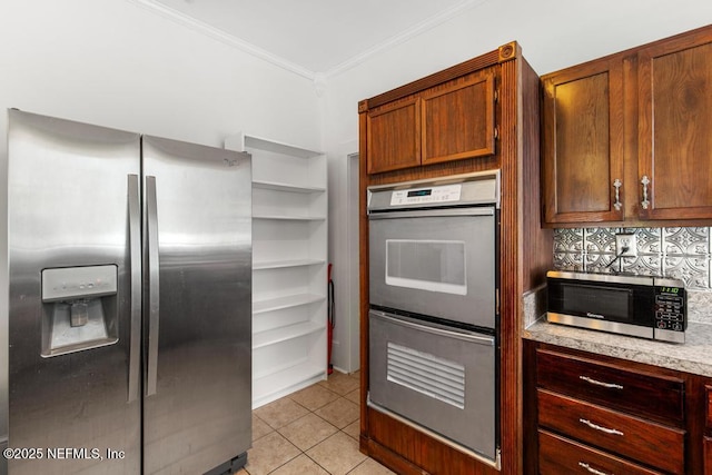 4215 Irvington Ave, Jacksonville, FL 32210 - kitchen featuring light countertops, crown molding, light tile patterned flooring, decorative backsplash, and appliances with stainless steel finishes