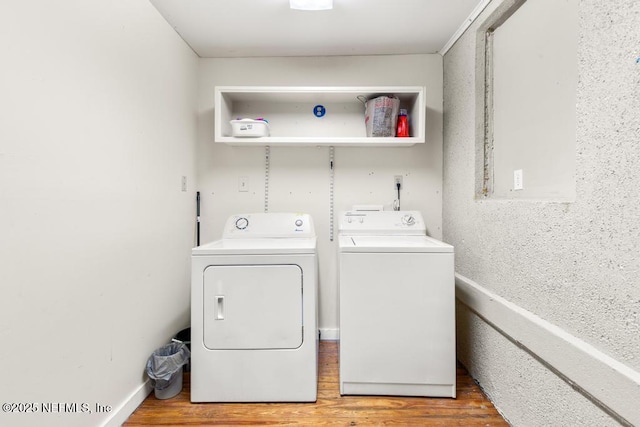 4215 Irvington Ave, Jacksonville, FL 32210 - clothes washing area featuring wood finished floors, washing machine and dryer, and laundry area