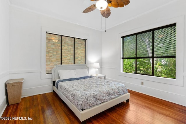 4215 Irvington Ave, Jacksonville, FL 32210 - bedroom featuring ornamental molding, baseboards, a ceiling fan, and hardwood / wood-style flooring