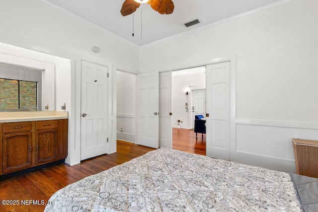 4215 Irvington Ave, Jacksonville, FL 32210 - bedroom featuring dark wood-type flooring, visible vents, crown molding, and a ceiling fan