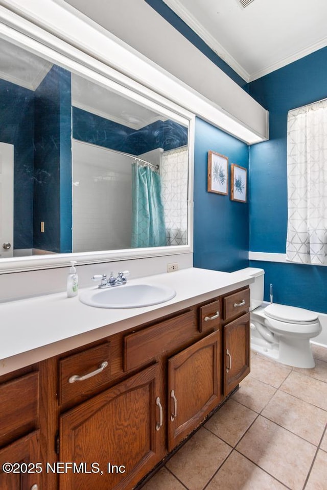 4215 Irvington Ave, Jacksonville, FL 32210 - full bath featuring toilet, crown molding, vanity, and tile patterned flooring