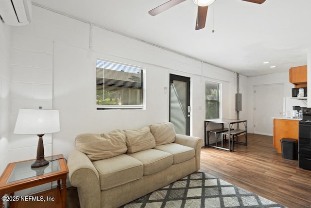 4215 Irvington Ave, Jacksonville, FL 32210 - living area with recessed lighting, an AC wall unit, a ceiling fan, and wood finished floors
