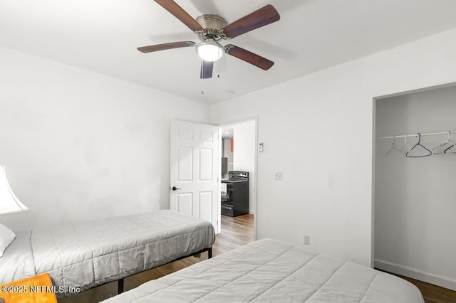 4215 Irvington Ave, Jacksonville, FL 32210 - bedroom featuring wood finished floors, a closet, baseboards, and a ceiling fan