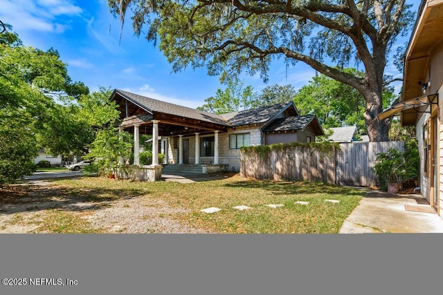 4215 Irvington Ave, Jacksonville, FL 32210 - view of front facade with a front lawn and fence