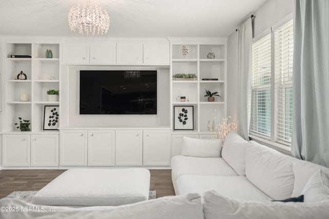 190 Palisade Dr, Saint Augustine, FL 32092 - living area featuring a notable chandelier and dark wood-type flooring