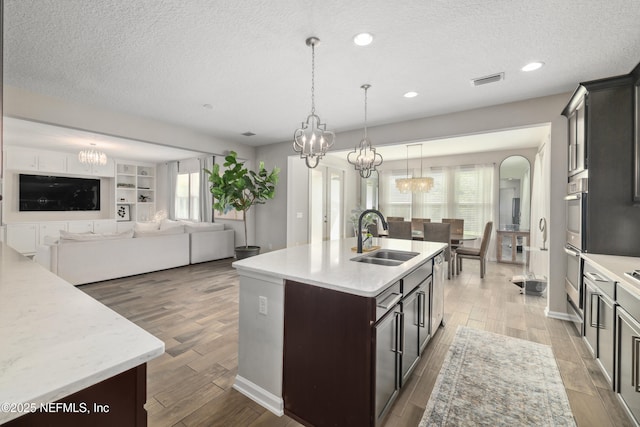 190 Palisade Dr, Saint Augustine, FL 32092 - kitchen with a notable chandelier, a sink, and light wood-type flooring