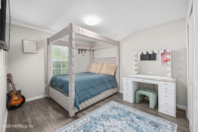 190 Palisade Dr, Saint Augustine, FL 32092 - bedroom with baseboards, wood finished floors, and a textured ceiling