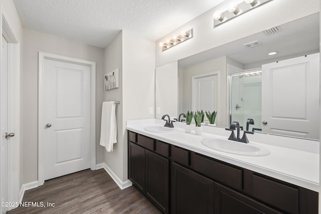190 Palisade Dr, Saint Augustine, FL 32092 - full bath with baseboards, an enclosed shower, wood finished floors, and a sink