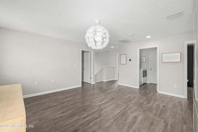 190 Palisade Dr, Saint Augustine, FL 32092 - unfurnished living room featuring dark wood-style floors, baseboards, recessed lighting, visible vents, and an inviting chandelier