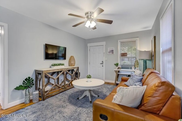 2969 Green St, Jacksonville, FL 32205 - living room featuring baseboards, wood finished floors, and ceiling fan