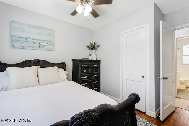 2969 Green St, Jacksonville, FL 32205 - bedroom featuring dark wood-style flooring, ensuite bathroom, baseboards, and a ceiling fan