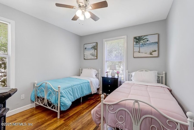 2969 Green St, Jacksonville, FL 32205 - bedroom featuring baseboards, multiple windows, wood finished floors, and a ceiling fan