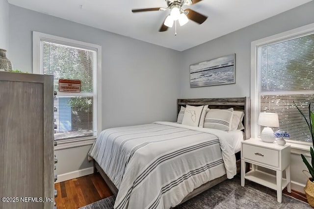 2969 Green St, Jacksonville, FL 32205 - bedroom with baseboards, multiple windows, wood finished floors, and a ceiling fan