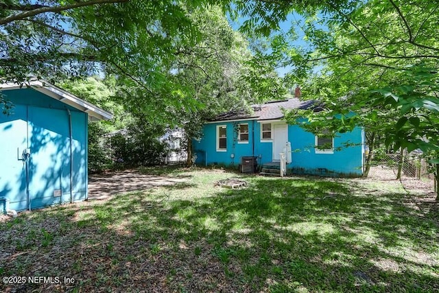 2969 Green St, Jacksonville, FL 32205 - view of yard featuring central air condition unit, a shed, fence, and an outdoor structure