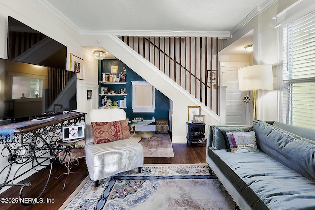 73 Weeden St, Saint Augustine, FL 32084 - living room with ornamental molding, wood finished floors, stairs, baseboards, and built in shelves
