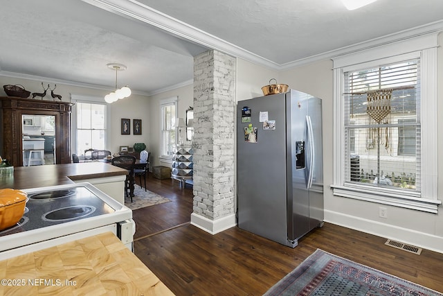 73 Weeden St, Saint Augustine, FL 32084 - kitchen featuring crown molding, stainless steel fridge with ice dispenser, dark wood finished floors, and visible vents
