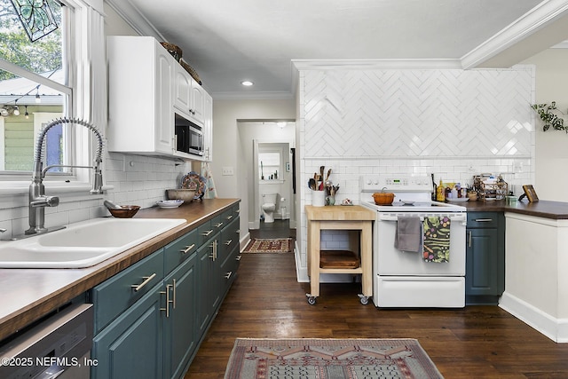 73 Weeden St, Saint Augustine, FL 32084 - kitchen with white range with electric cooktop, ornamental molding, black dishwasher, stainless steel microwave, and a sink