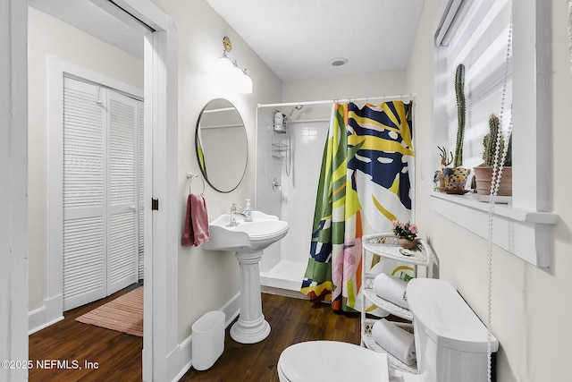 73 Weeden St, Saint Augustine, FL 32084 - bathroom with toilet, curtained shower, wood finished floors, and baseboards