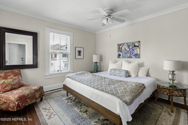 73 Weeden St, Saint Augustine, FL 32084 - bedroom featuring crown molding, baseboards, ceiling fan, and wood finished floors