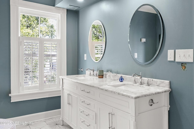 73 Weeden St, Saint Augustine, FL 32084 - full bath with a sink, baseboards, and double vanity