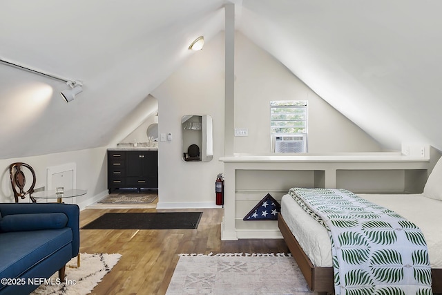 73 Weeden St, Saint Augustine, FL 32084 - bedroom with wood finished floors, baseboards, and lofted ceiling