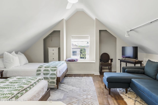 73 Weeden St, Saint Augustine, FL 32084 - bedroom with rail lighting, baseboards, vaulted ceiling, and wood finished floors