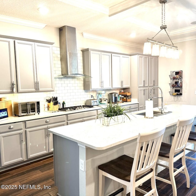 273 Caribbean Pl, Saint Johns, FL 32259 - kitchen featuring a sink, gas stovetop, wall chimney exhaust hood, dark wood-type flooring, and ornamental molding