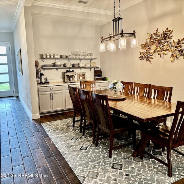 273 Caribbean Pl, Saint Johns, FL 32259 - dining area with crown molding, dark wood finished floors, and baseboards
