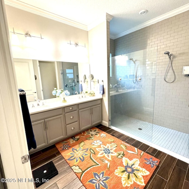 273 Caribbean Pl, Saint Johns, FL 32259 - full bath with wood tiled floors, ornamental molding, a tile shower, and double vanity