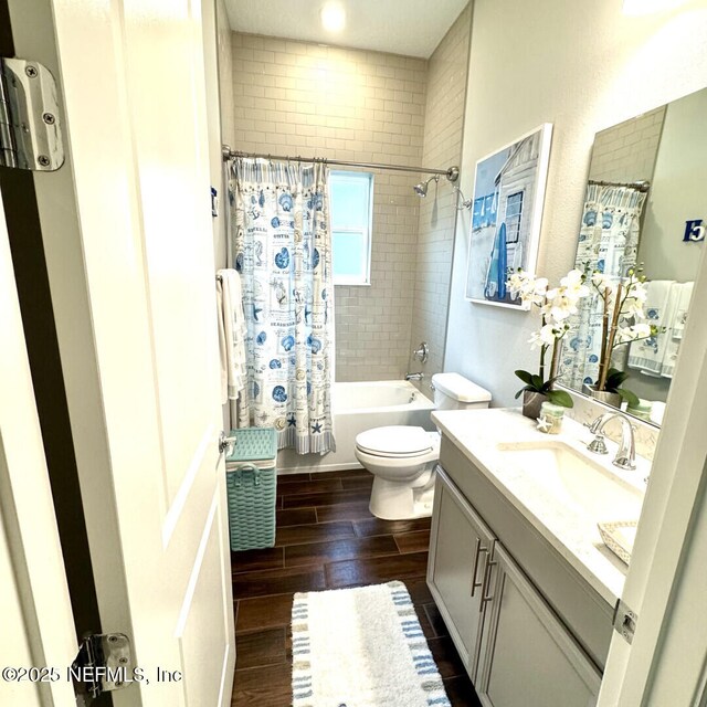 273 Caribbean Pl, Saint Johns, FL 32259 - bathroom featuring wood finished floors, shower / bathtub combination with curtain, toilet, and vanity