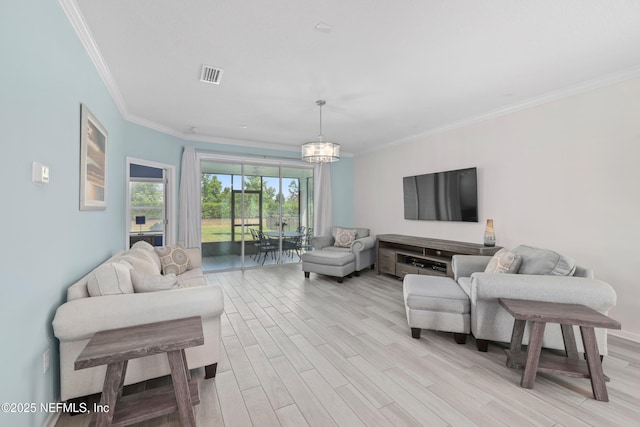 58 Strobe Ct, Saint Augustine, FL 32095 - living area with light wood-style floors, ornamental molding, and a chandelier