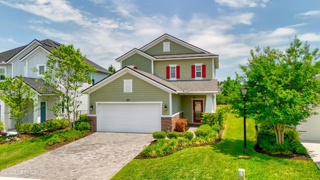 58 Strobe Ct, Saint Augustine, FL 32095 - craftsman-style home with decorative driveway, a front yard, and a garage