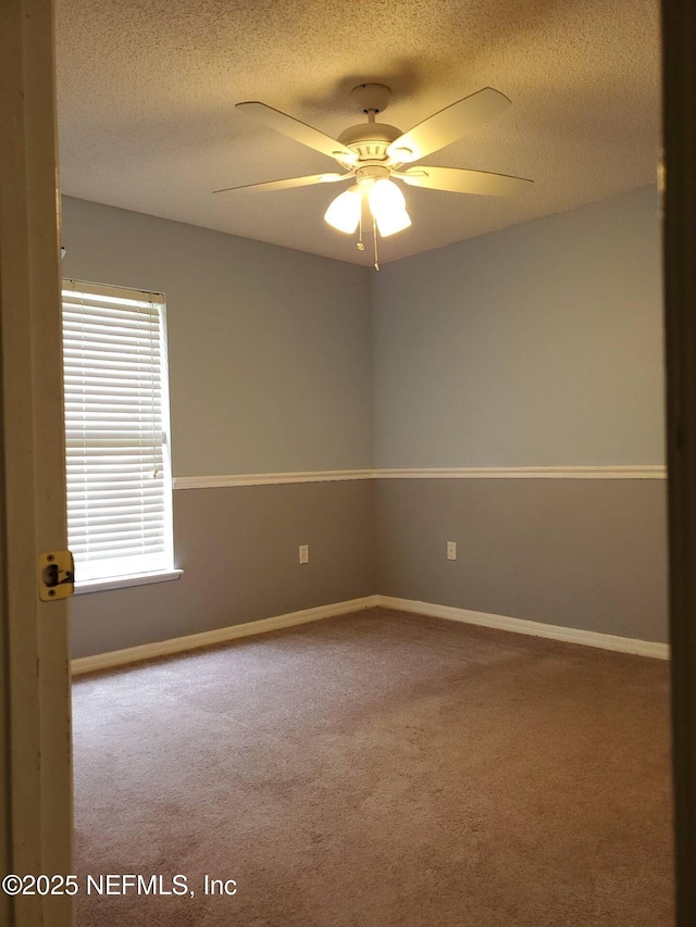 3429 Steelgate Ct, Middleburg, FL 32068 - unfurnished room with baseboards, a textured ceiling, a ceiling fan, and carpet floors