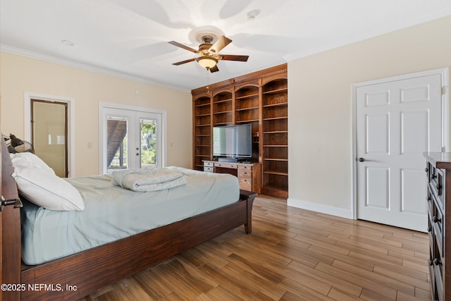 bedroom featuring wood finished floors, access to exterior, a ceiling fan, ornamental molding, and baseboards