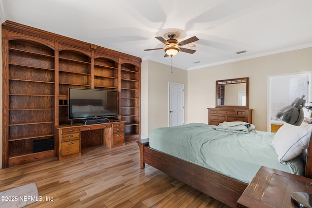 bedroom featuring light wood-style flooring, visible vents, crown molding, and a ceiling fan